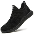 Low-cut black safety shoes with a steel toe cap on a plain background.