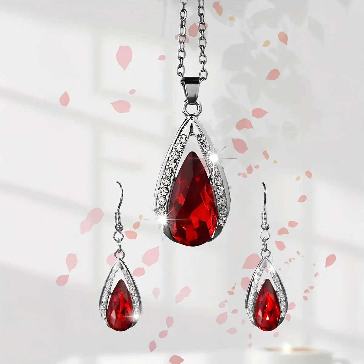 Black and red teardrop pendant necklace and matching alloy earrings set.