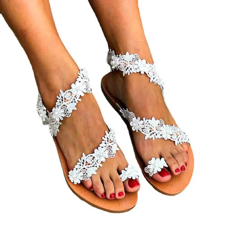 White women's sandals with rhinestone floral decoration and patent leather upper in sizes 35-43