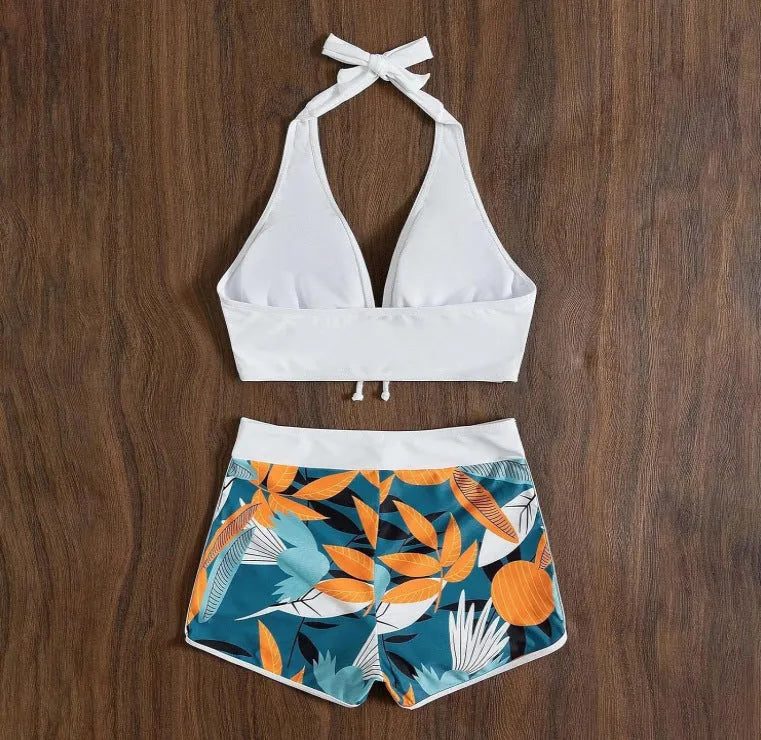 Women's solid colour white split top swimsuit with leaf print boxers bottoms, backless, sleeveless, polyester fabric