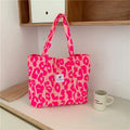 Women's large capacity oxford cloth shoulder bag with a three-dimensional front pocket.
