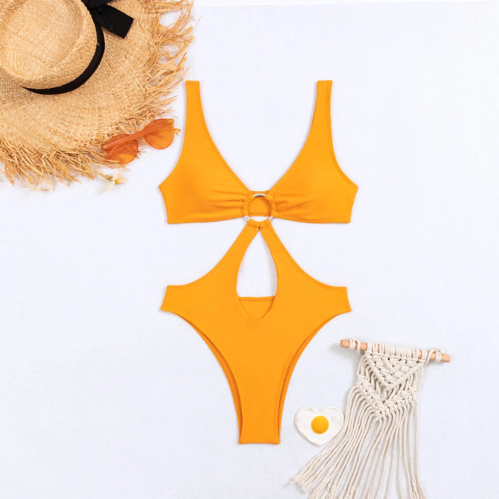 Women's black triangle one-piece swimsuit laid flat, showing sleeveless design.