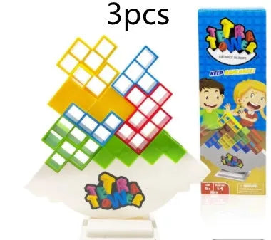 Plastic balance stacking board game with 16 colourful blocks, chassis, and base on a table.