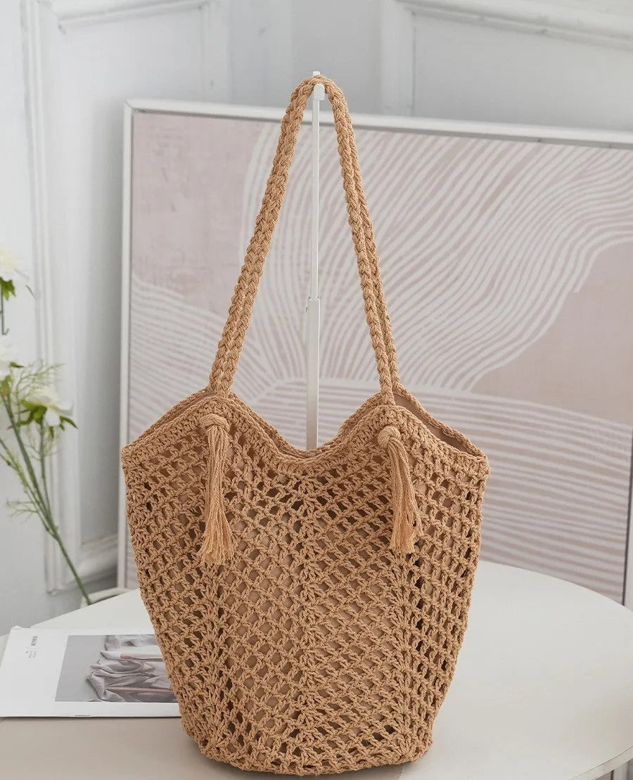 Handmade cotton thread woven hollow shoulder bag with tassel in creamy-white, vertical square shape, open pocket