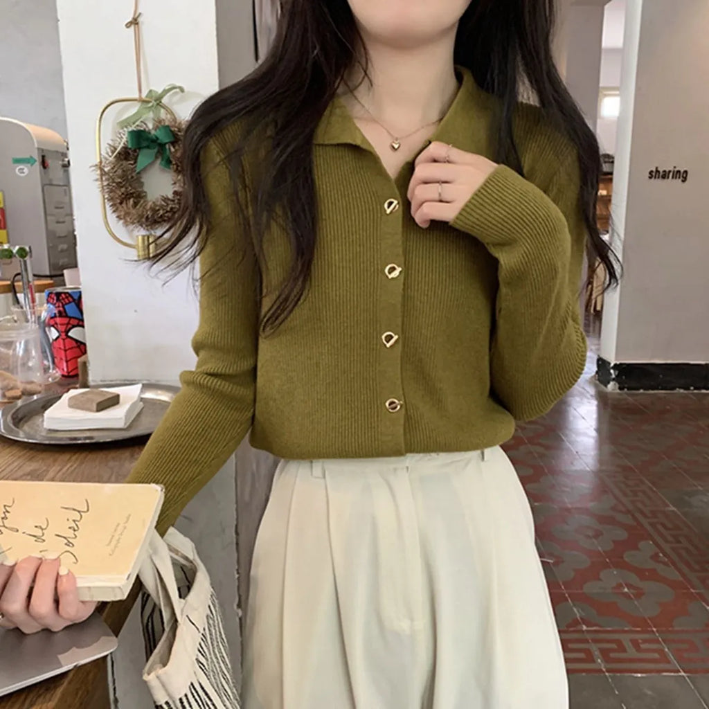 Women's beige knitted cardigan top with long sleeves shown open as a layering piece