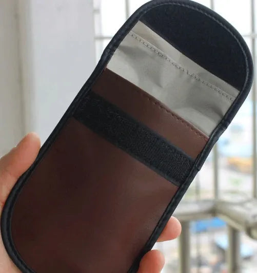Black rectangular microfiber RFID shielding bag for car keys and bank cards.