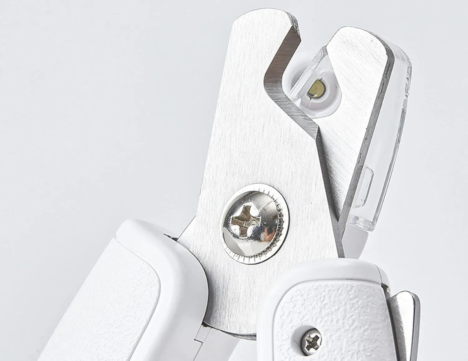 White LED pet nail clippers for cats and dogs with open transparent safety guard and nail file.