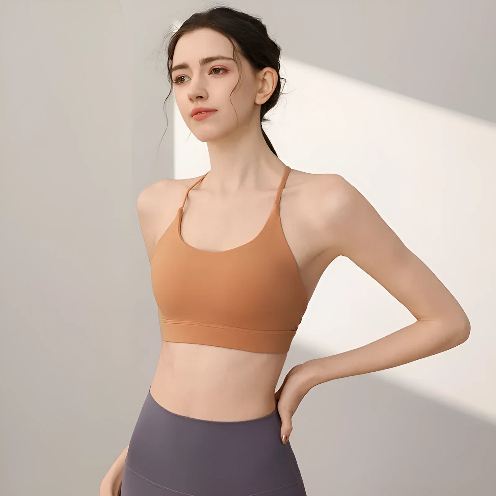 Women's nylon sports vest with fixed double shoulder straps in multiple colours.