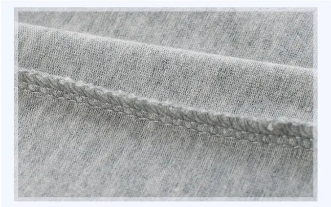 Grey children's cotton T-shirt laid flat, showing a size chart for measurements from 90cm to 140cm.
