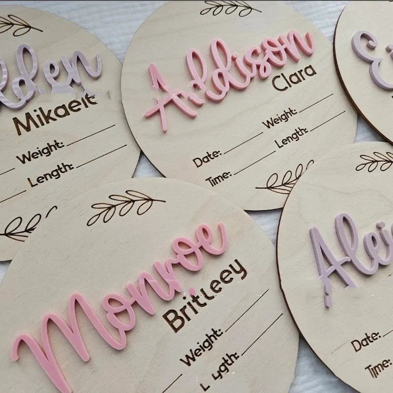Square wooden name plaque engraved with newborn birth details for nursery wall display