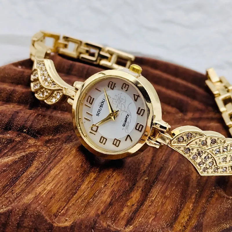 Women's stainless steel watch with gold face round dial and vachette clasp buckle