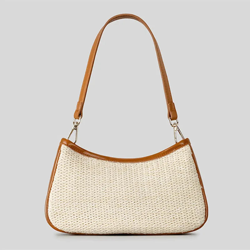 Khaki coloured hand-woven straw crossbody bag with a single strap and an internal phone pocket.