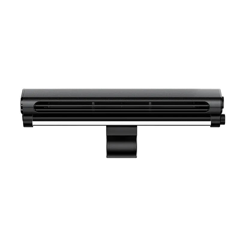 Black clip-on bladeless fan with integrated light attached to a laptop screen.