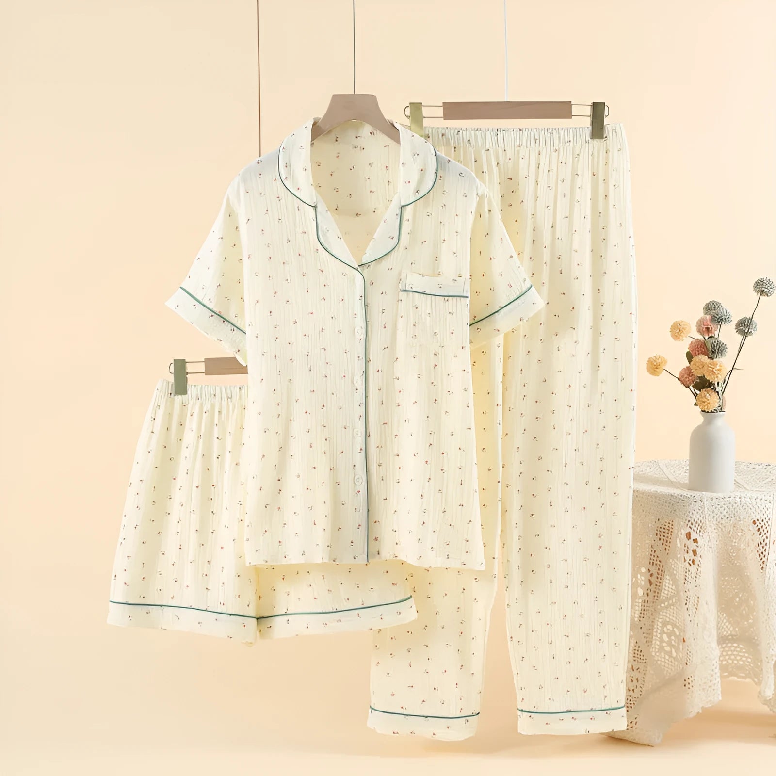 Women's pastoral gold cotton three-piece pajama set with lapel collar and three-quarter sleeves.