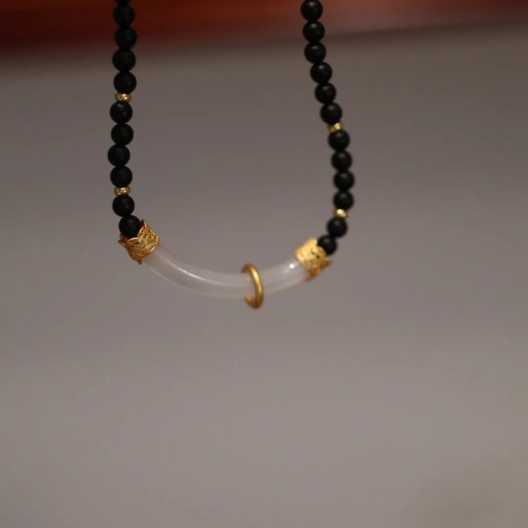 Frosted black agate pendant necklace with white chalcedony detailing on 925 silver chain