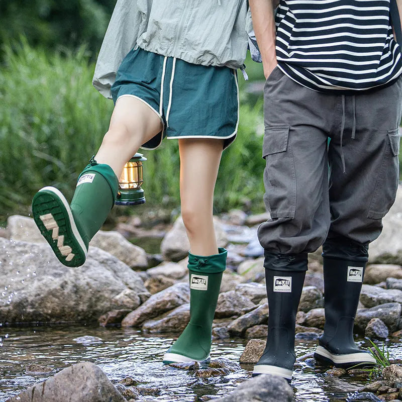 Pair of solid colour platform heel PVC wellington boots for men and women.