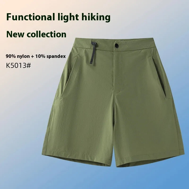 Men's solid colour quick-dry sports shorts with elastic sides for running and climbing.