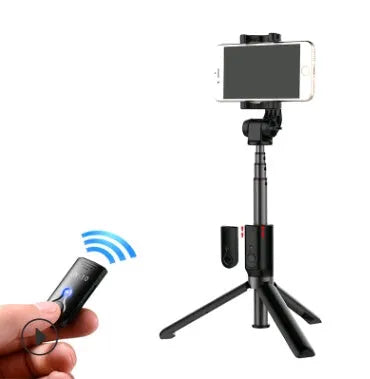 Aluminium alloy Bluetooth selfie stick with remote control and adjustable phone clip next to a smartphone