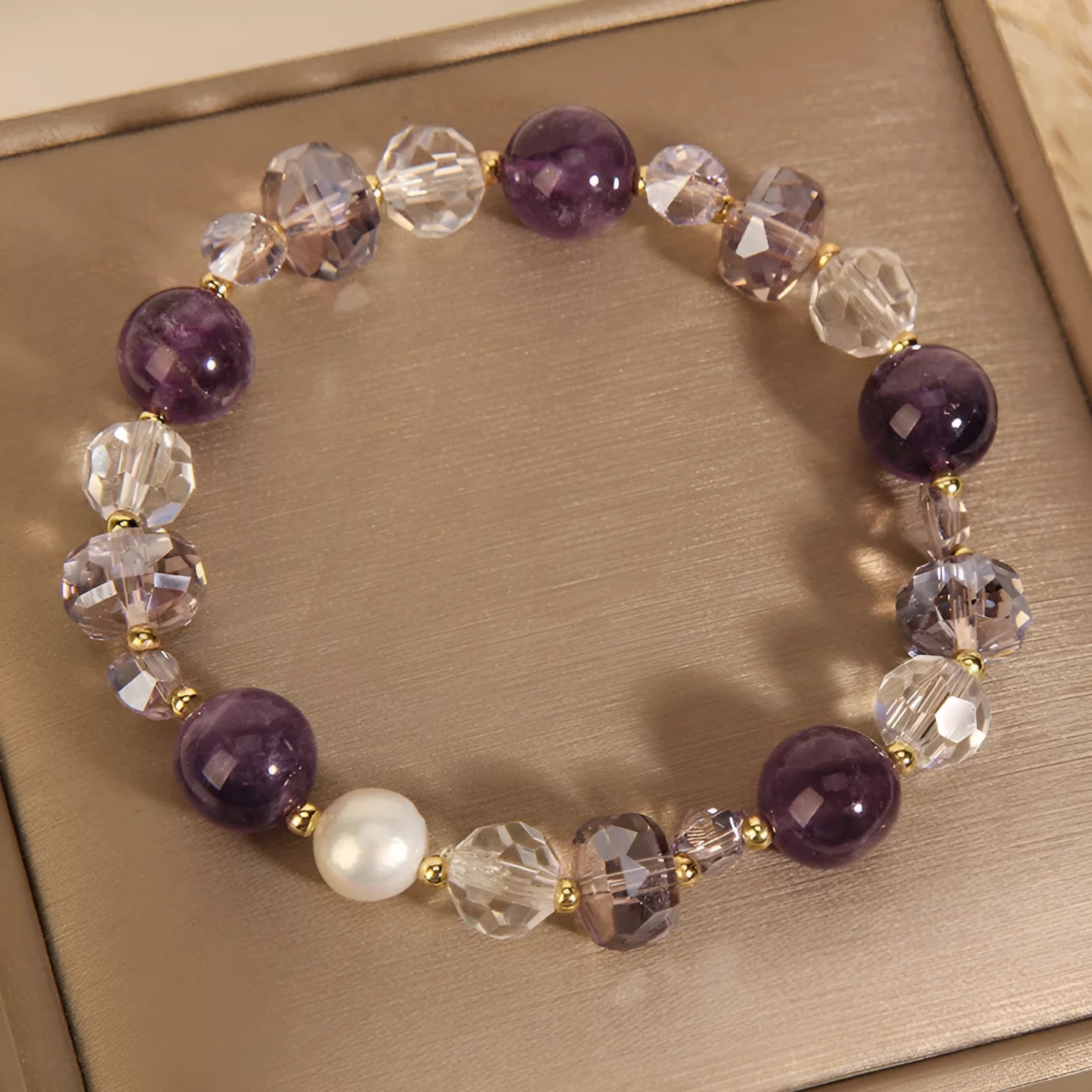 Women's U-shaped artificial amethyst bracelet with pearl and four-leaf clover charm on wrist