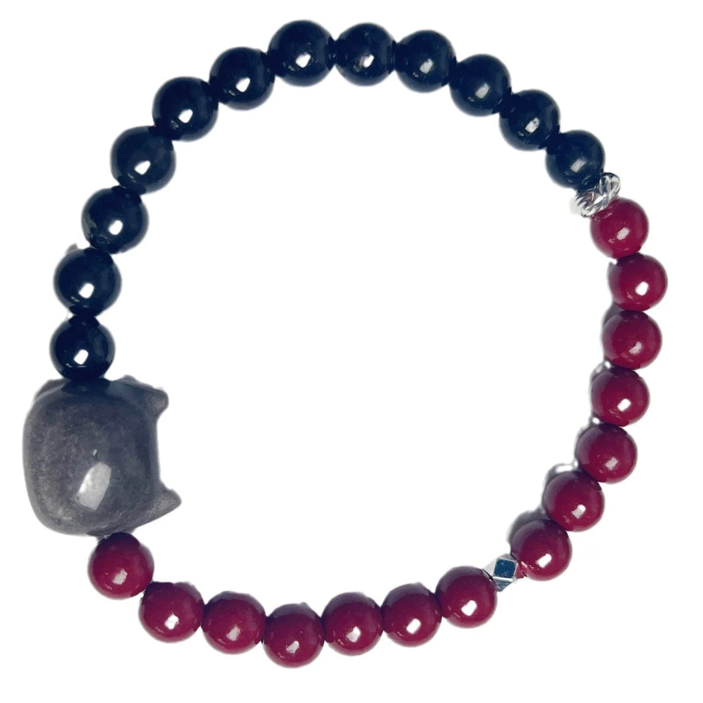 Handcrafted obsidian bracelet with colourful gemstone beads and silver cat charm on wrist