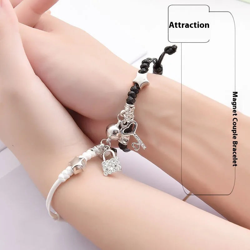 Magnetic couple's alloy bracelet pair with electroplated finish in various designs like crown, cross, and kitten.