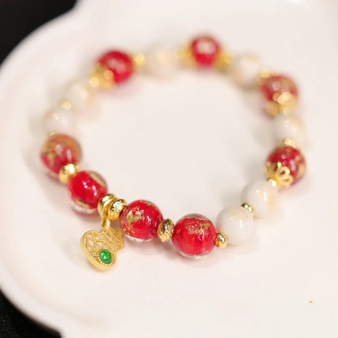 Women's ethnic bracelet with gold foil coloured glaze and geometric design