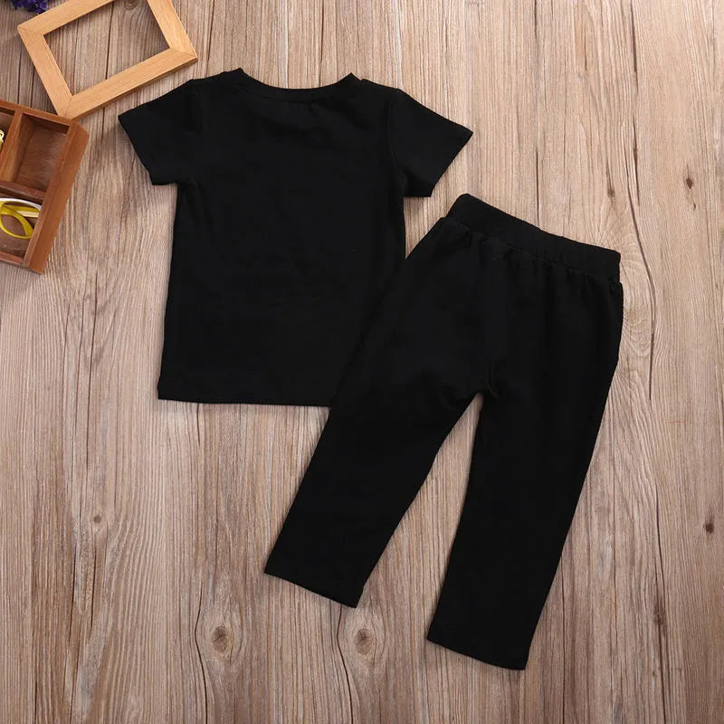 Black summer children's cotton short sleeve two-piece set on a white background