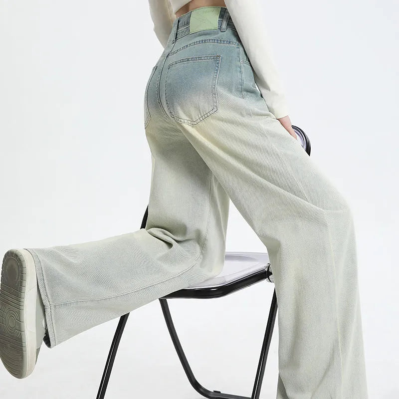 Women's gradient blue wide-leg straight-leg denim trousers on a hanger.