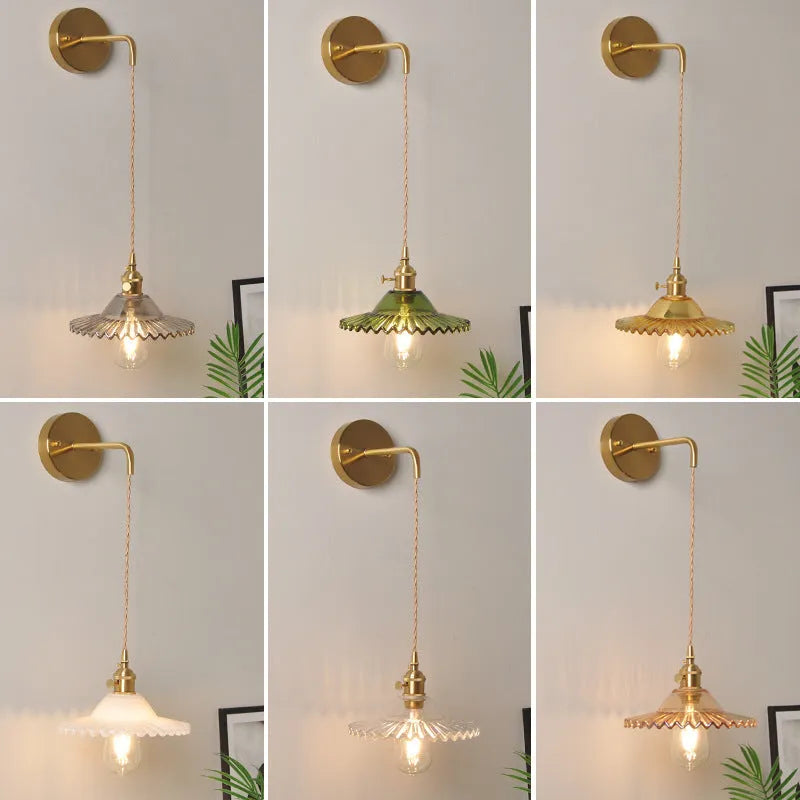 Brass-coated lotus wall lamp with a glass shade on an adjustable wire, shown in a white colour variant.