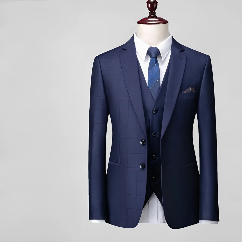 Men's navy blue plaid slim fit three-piece suit with vest, jacket, and trousers on hanger