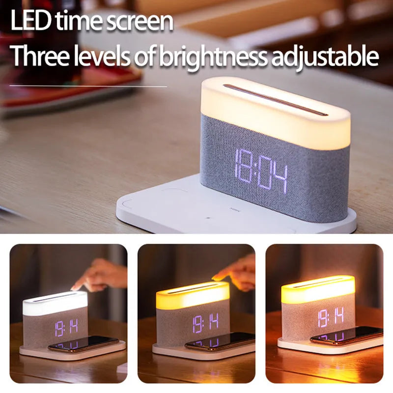 A compact black wireless charging table lamp with a digital clock display and integrated night light on a wooden desk.