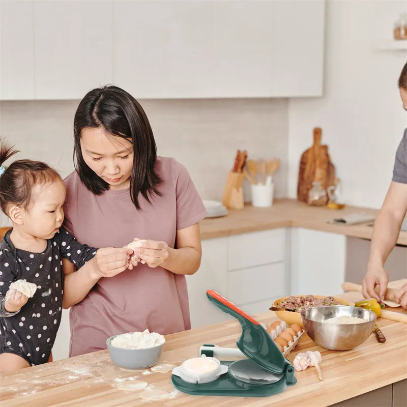 3 In 1 plastic dumpling maker with rolling pin and moulds, green colour, on kitchen countertop