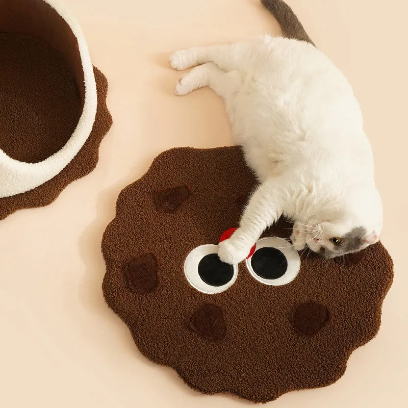 Khaki coloured enclosed cat house with circular entrance, nest-shaped like a sandwich cookie