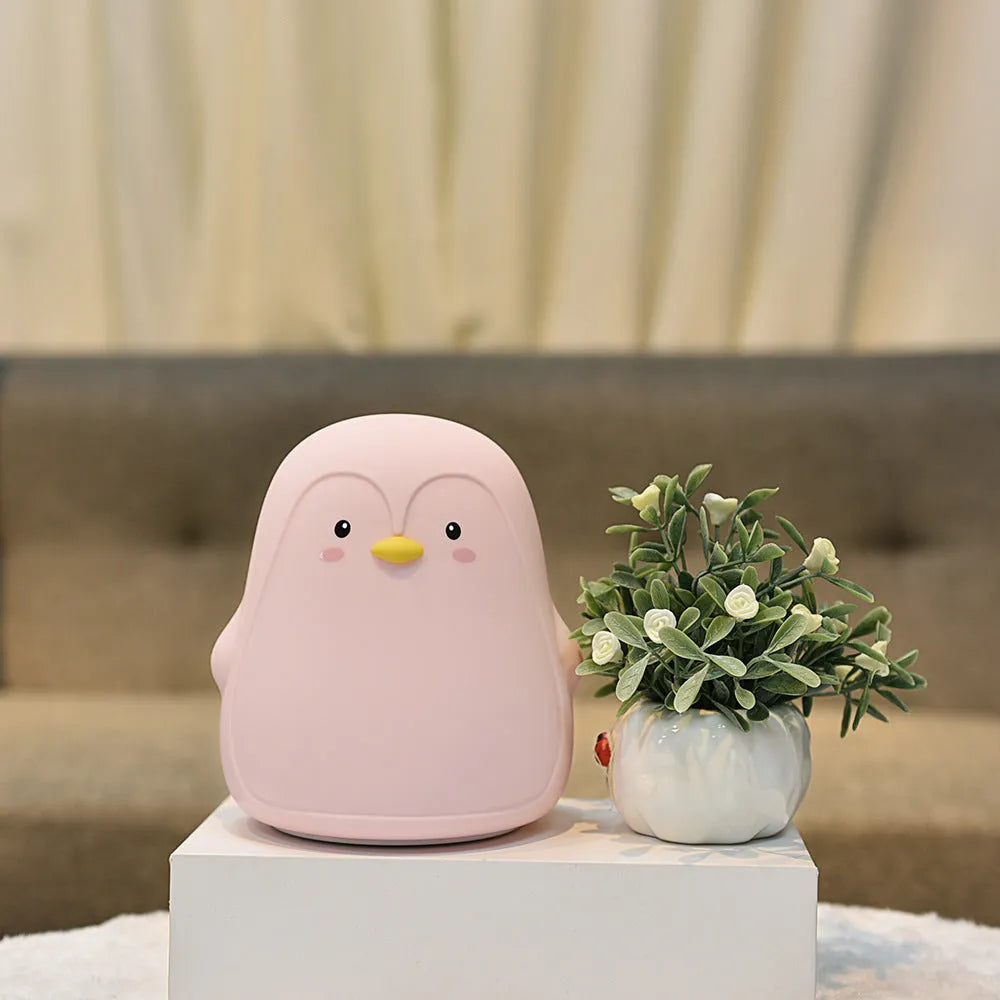 Penguin-shaped rechargeable night light with USB cable, white LED illumination, silicone ABS construction