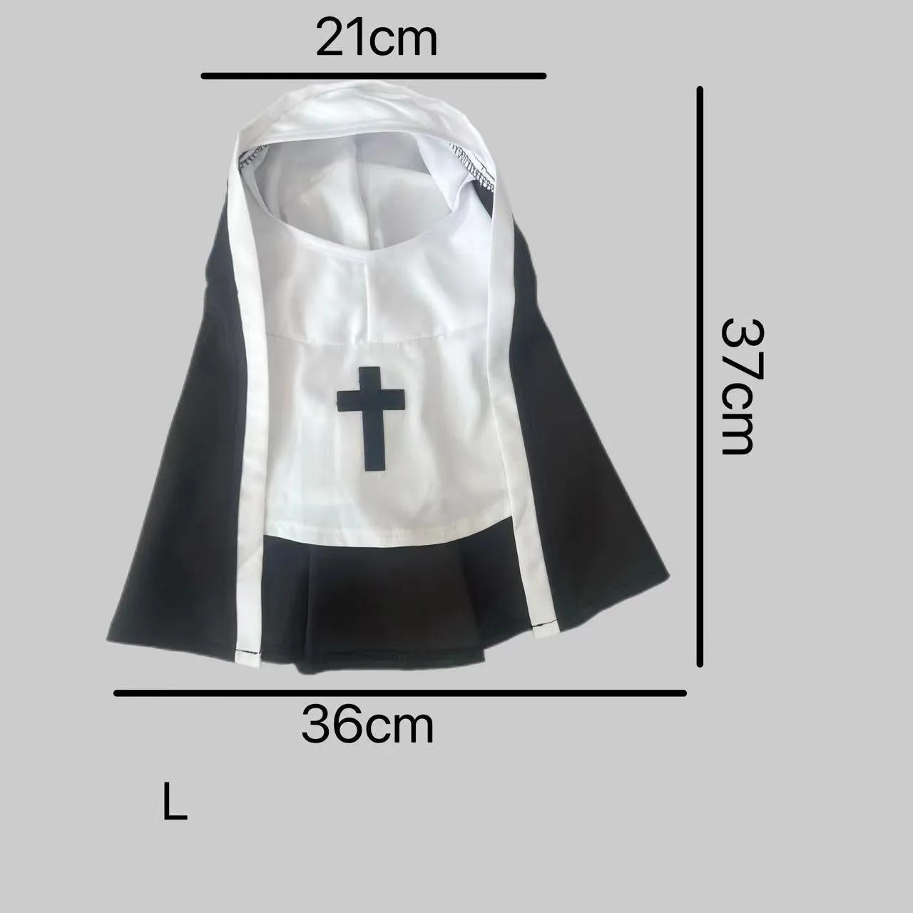 Black and white nun costume cloak outfit on a small or medium dog for Halloween.