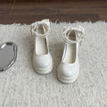 Women's beige chunky heel Mary Jane shoes with a round toe and strap.
