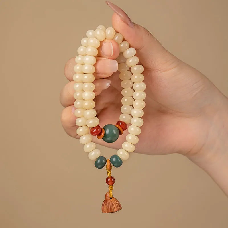 Wooden bracelet with flat round cream topaz beads for a 15-20cm wrist.