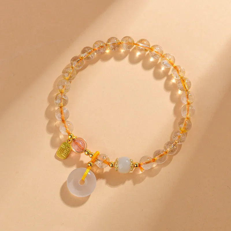 Gold rutilated quartz crystal bracelet with safety buckle and geometric pendant