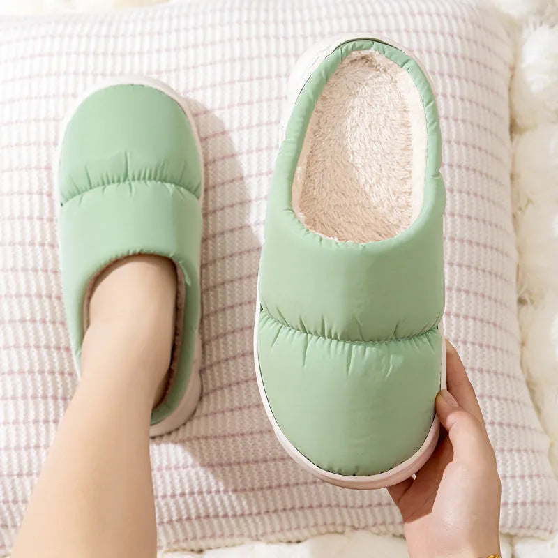 Blue down cotton slippers with thick rubber sole and plush lining, shown from side.