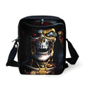 A medium-sized black children's messenger bag with a white skull print, showing the front zipper pocket and adjustable shoulder straps.