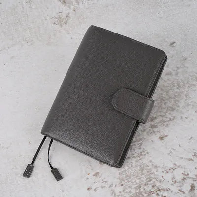 A6 size leather loose-leaf diary with a textured lychee pattern cowhide cover