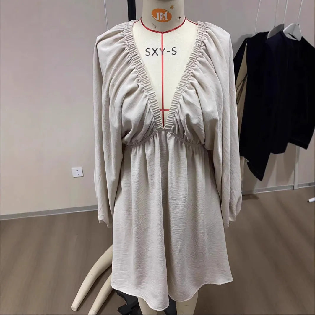 Women's polyester puff sleeve dress with V-neck and flounced swing skirt in apricot colour