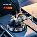Silver metal solar helicopter car air freshener ornament rotating on a dashboard.