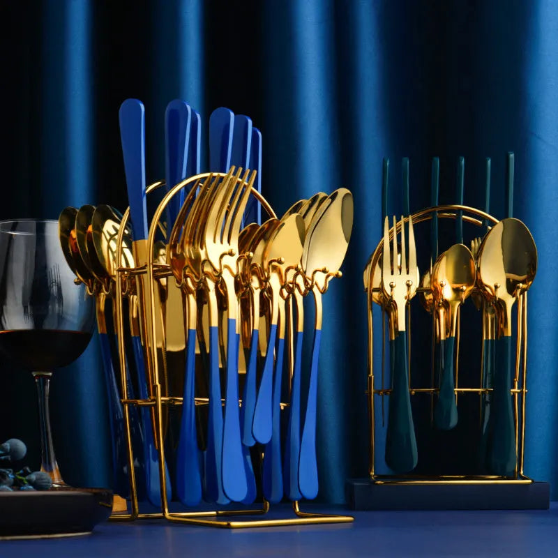 Gold stainless steel 24-piece cutlery set with storage rack containing knives, forks, spoons and teaspoons