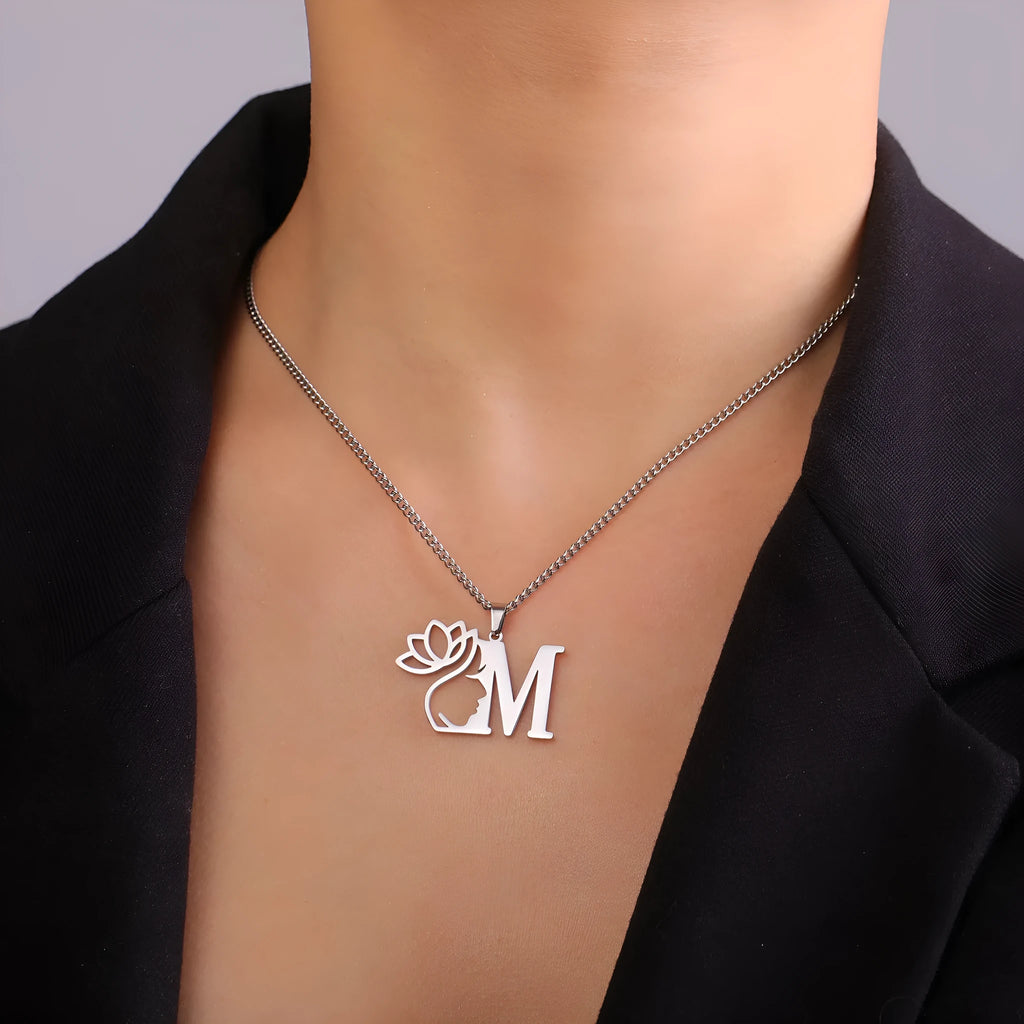Stainless steel fashion necklace with cross chain links and a pendant, available in gold and silver finishes.
