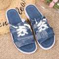 Blue Roman style women's flat canvas slippers with a rubber sole on a plain background.