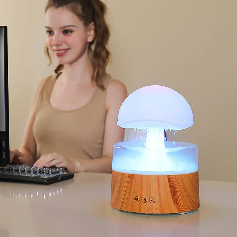 White rain cloud humidifier with falling raindrop effects and LED lighting
