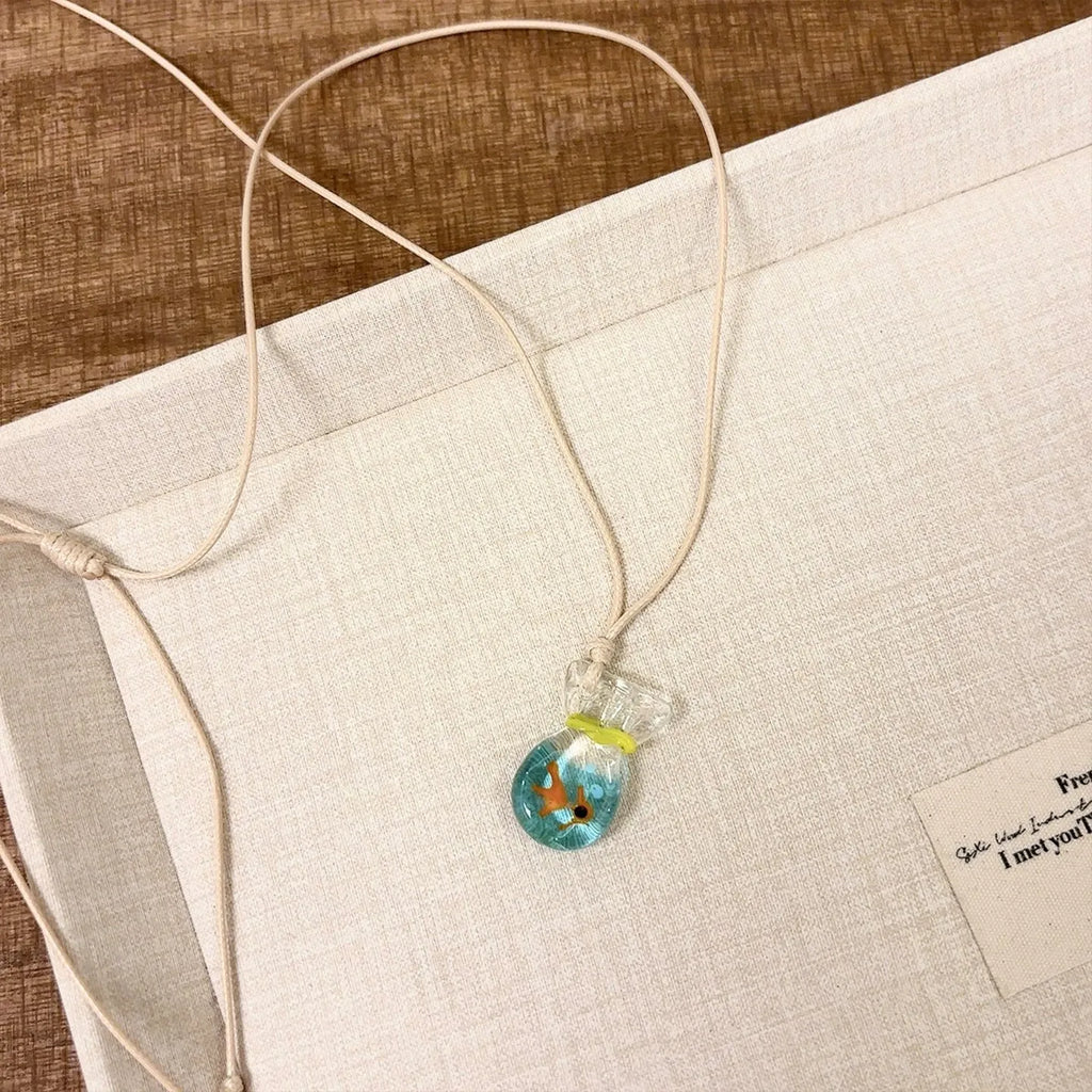 Women's skirt joker pendant necklace with coloured glaze charm on cotton linen chain