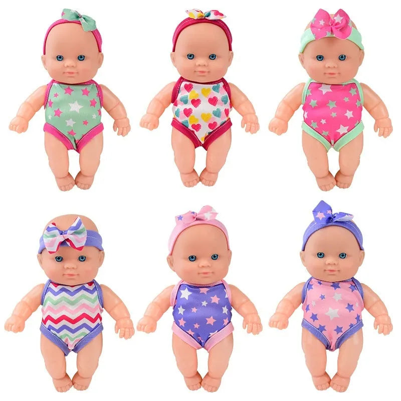 21.5cm tall simulation baby vinyl figurine doll in one of six colour variations on display