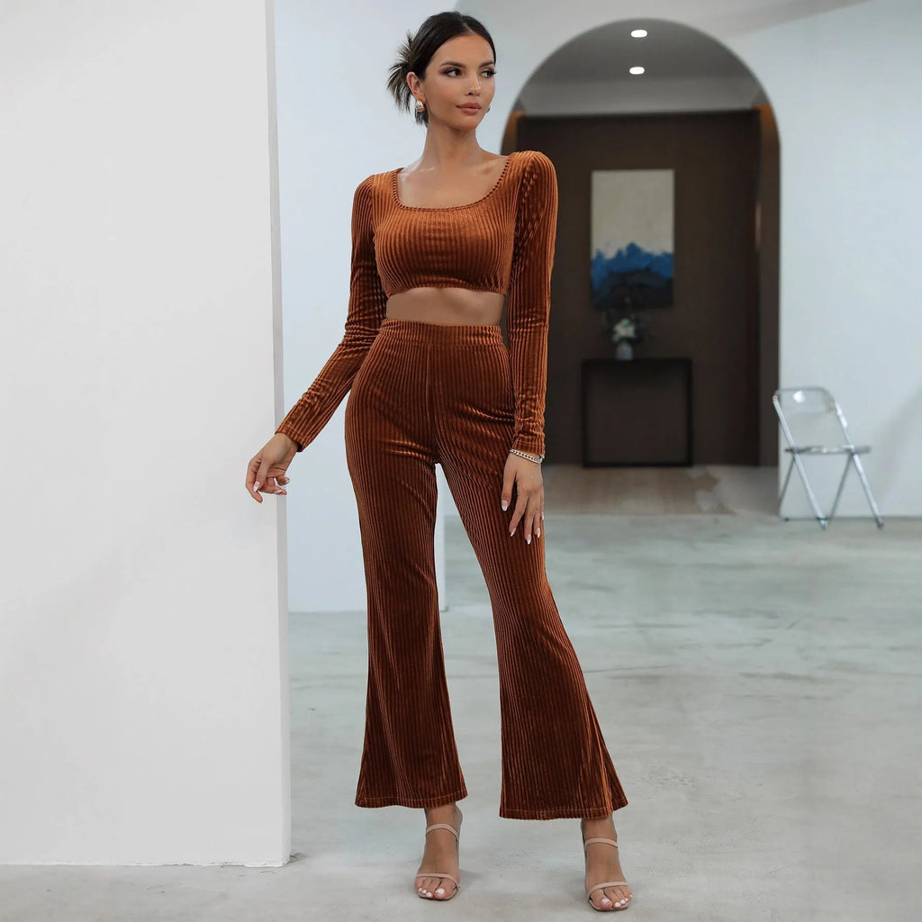 Caramel coloured long sleeve sweater and trouser casual set on a hanger.